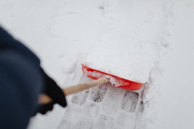 red shovel in the snow